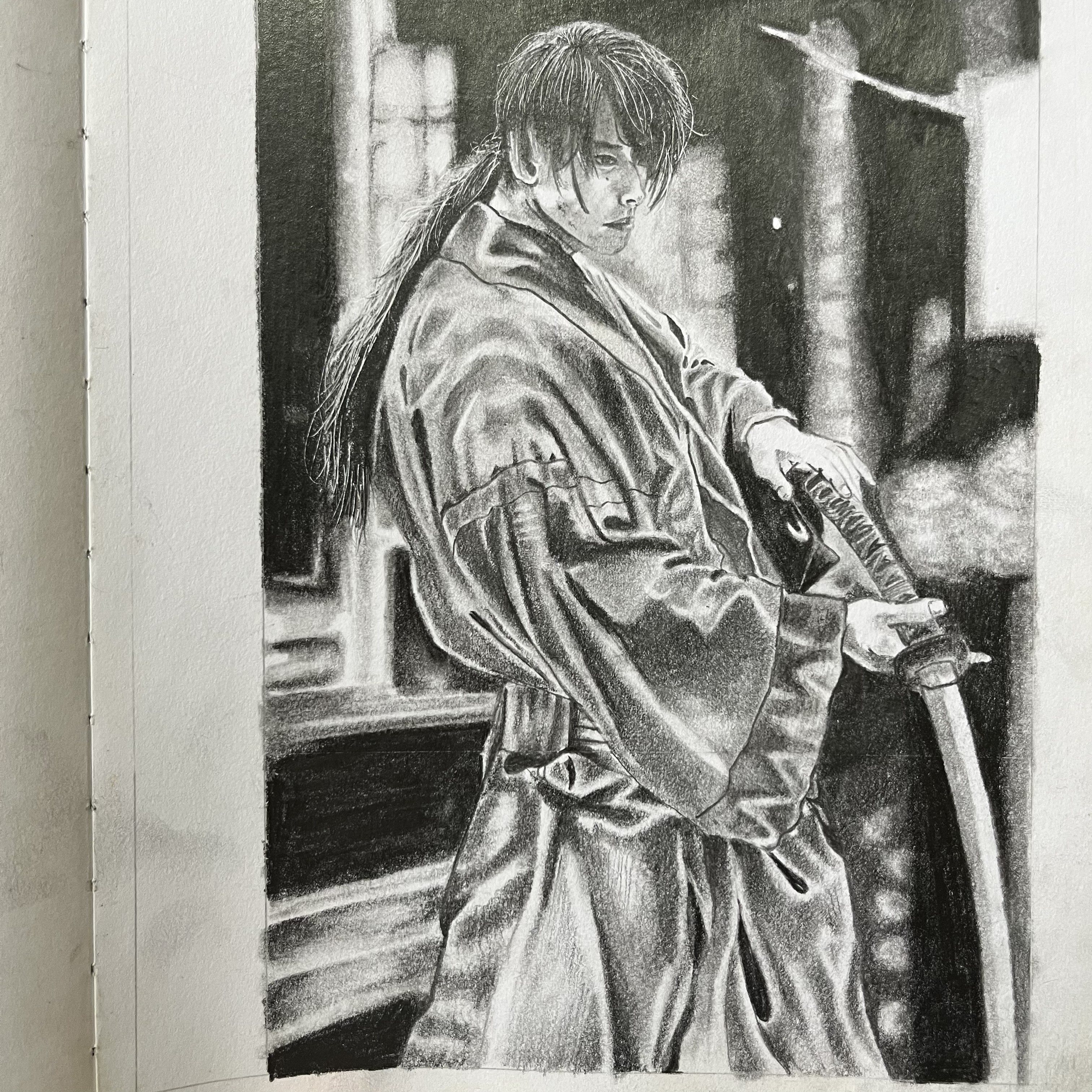 Graphite portrait of a swordsman in layered clothing holding a katana